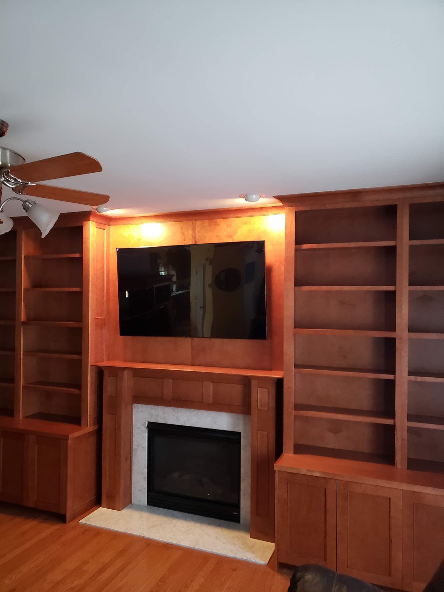 Full wall entertainment center with fireplace by Professional Wood Interiors - St. Louis, MO