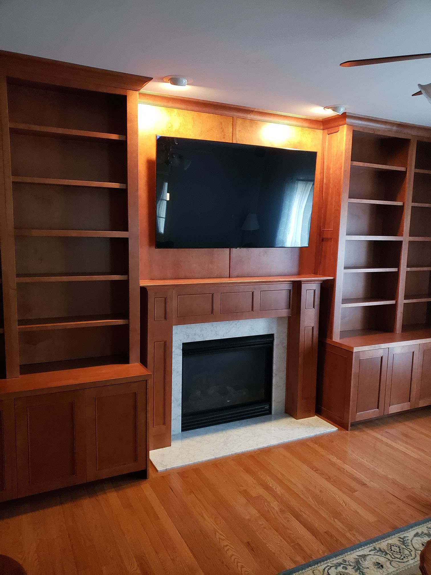 Architectural entertainment center with wire management by Professional Wood Interiors - St. Louis, MO
